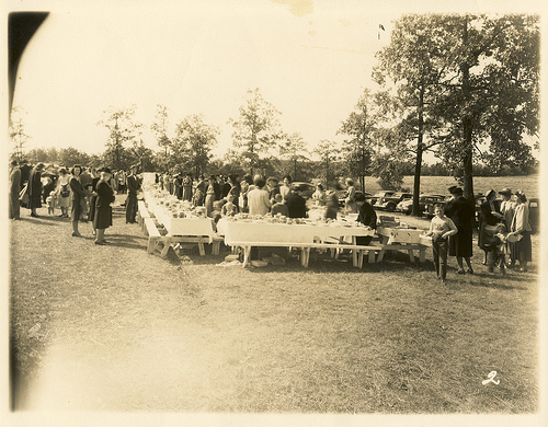 Family having dinner on the church grounds